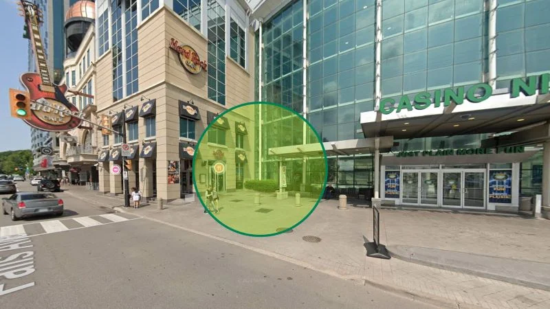 Street-level sidewalk view of sidewalk meeting point pickup location showing the exact spot where guests meet their walking tour guide